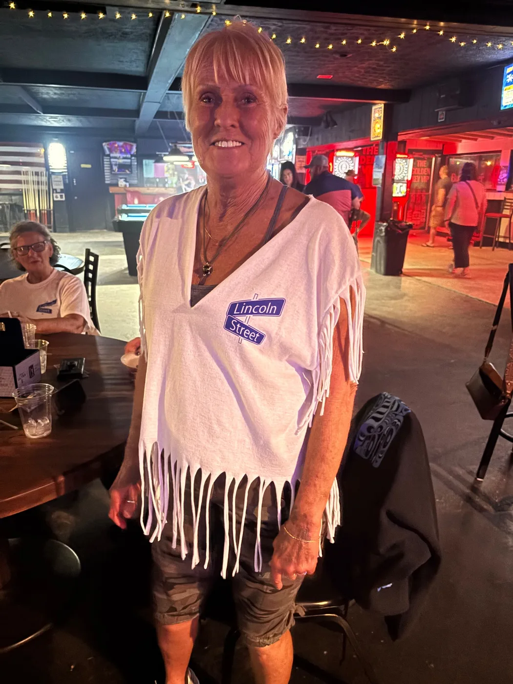 Lincoln Street Band fan showing the back of a Lincoln Street shirt